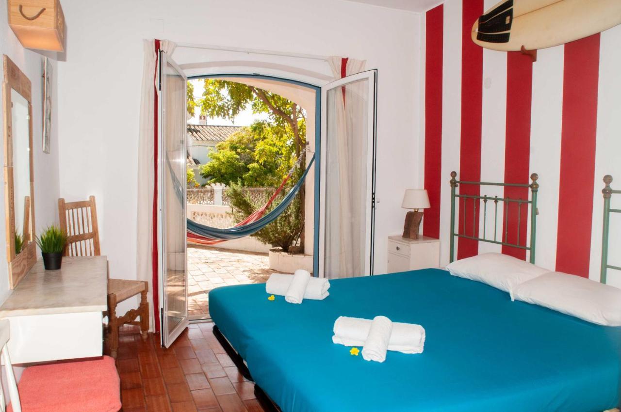 Хостел Jho'La Surf Camp Praia Da Luz Экстерьер фото